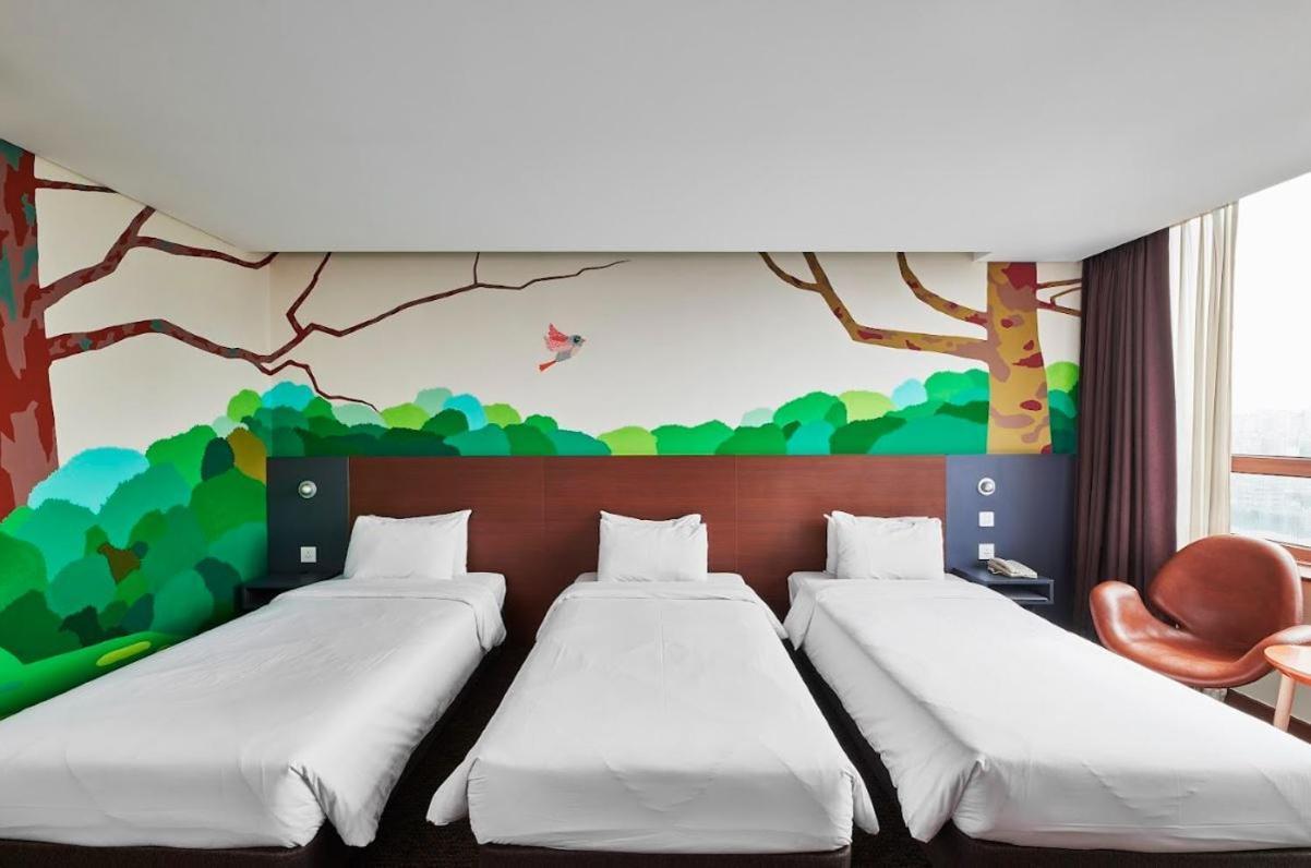 โรงแรมสกายพาร์ค คิงส์ทาวน์ ทงแดมุน โรงแรม 4*